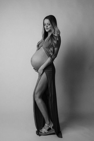 Artistic black and white maternity photography series showing silhouette poses.