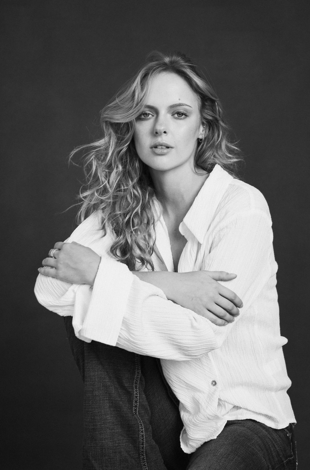 Fashion portrait in white button-down shirt with dynamic poses.