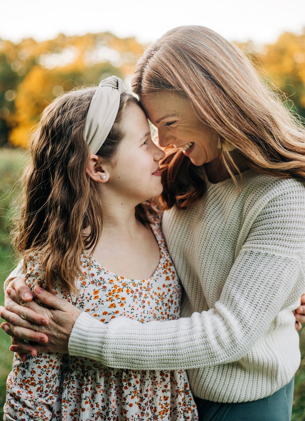 two girls smile at each other