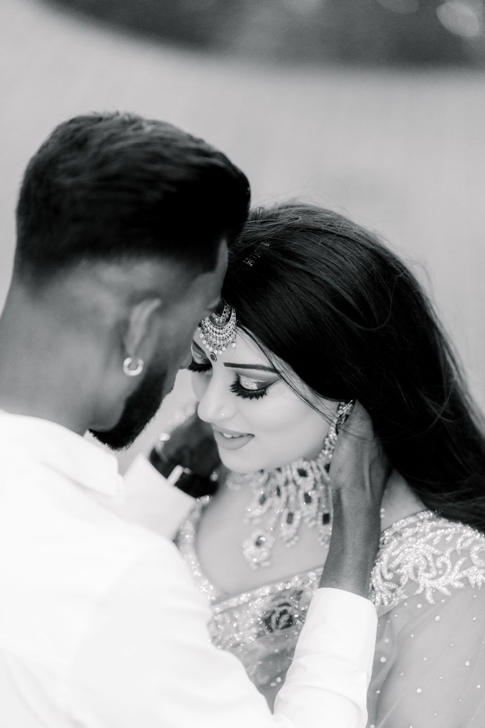 A romantic black and white wedding photo sequence captures an intimate close-up moment between newlyweds.
