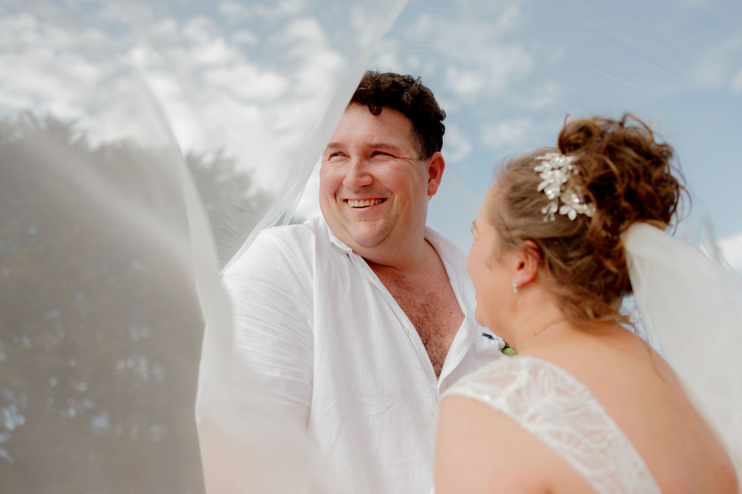 Wedding portraits captured in a manicured garden with stone pathways.