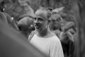 Black and white portrait captured during an outdoor event.