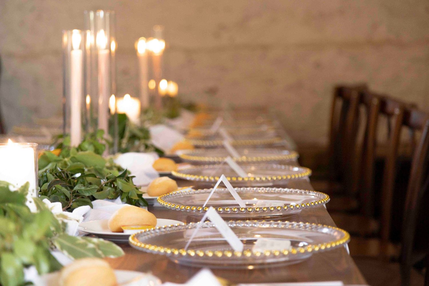 ong tables with rustic wedding decor and candles in Warrawong Estate barn