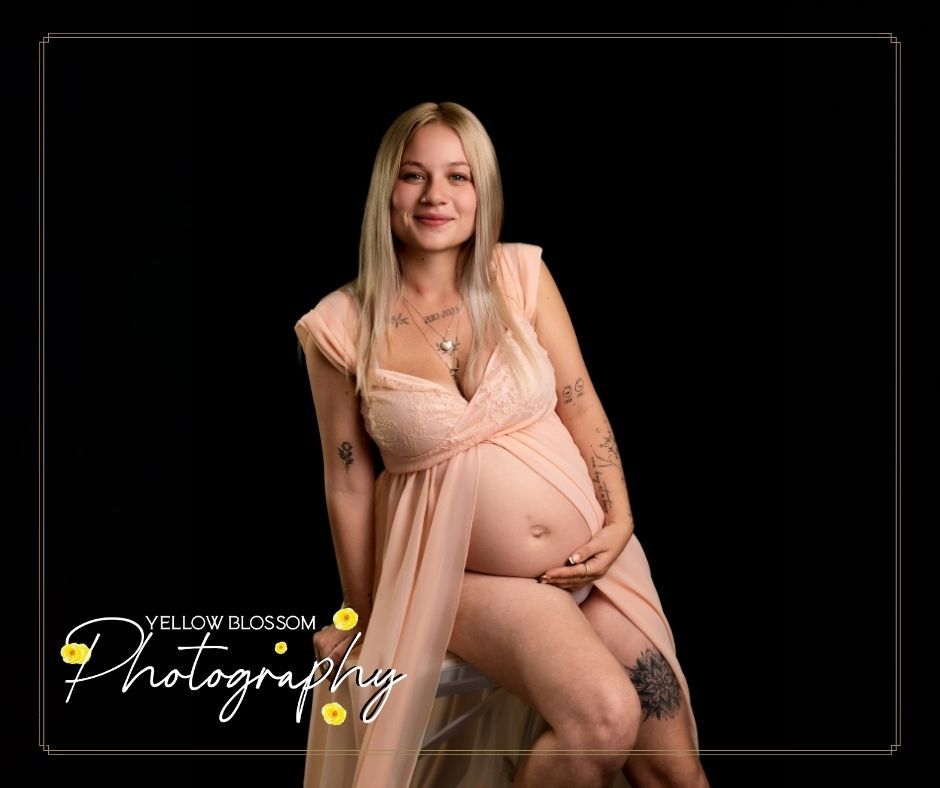 A maternity photo shows an expectant mother in a flowing peach dress against a dark background.