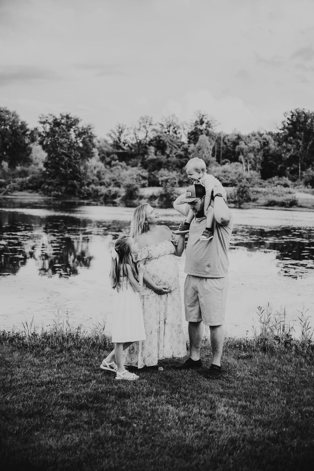 Vintage black and white photographs show people standing at lake edge across multiple sequential frames.