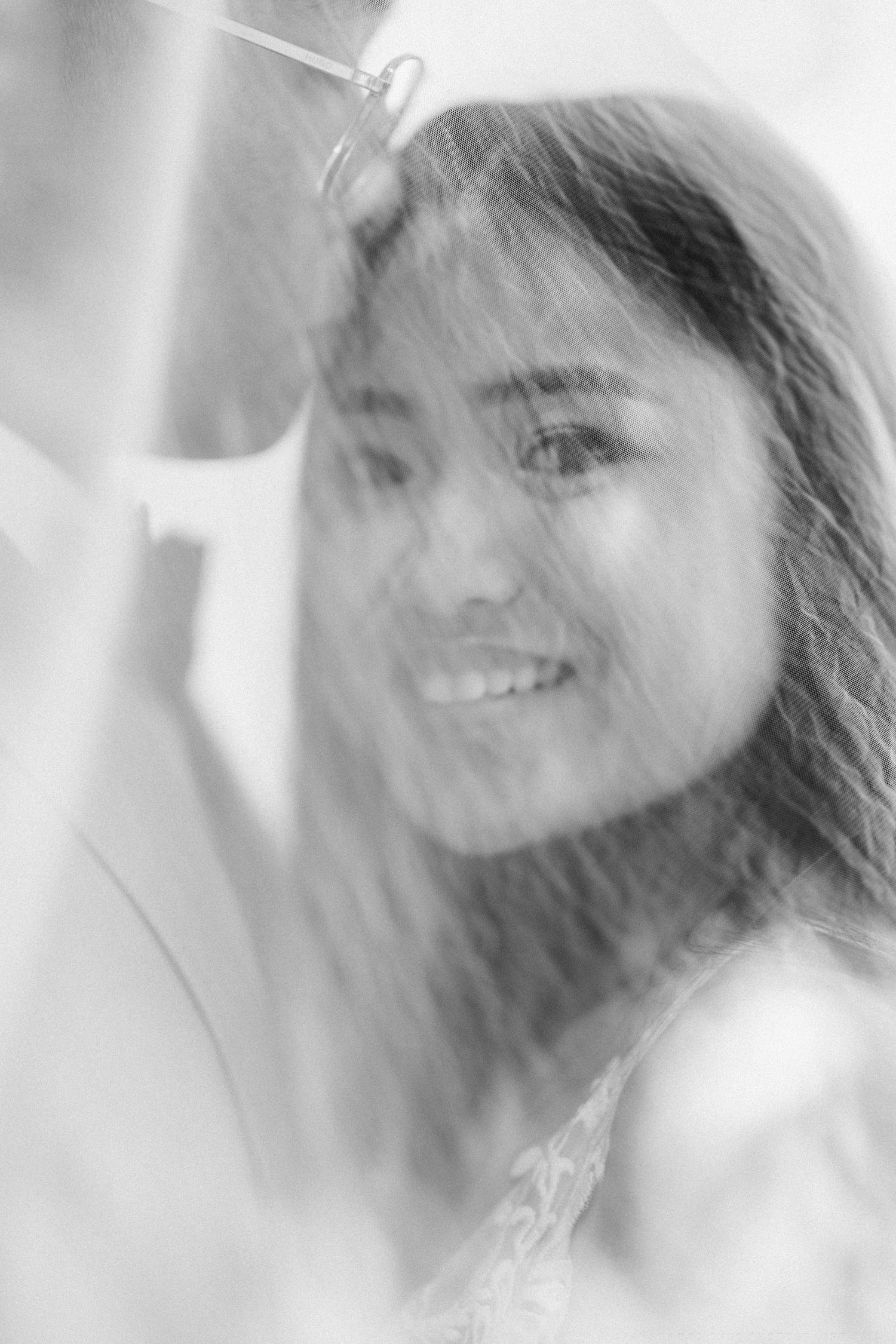 Soft black and white portrait with dreamy bokeh effect.
