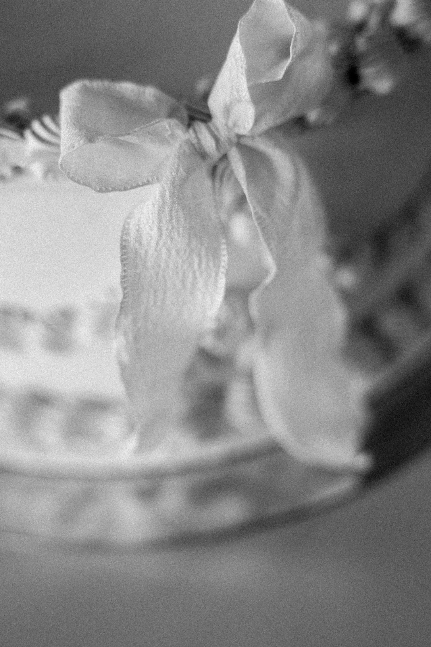 Close-up abstract details of delicate white lace and fabric textures.
