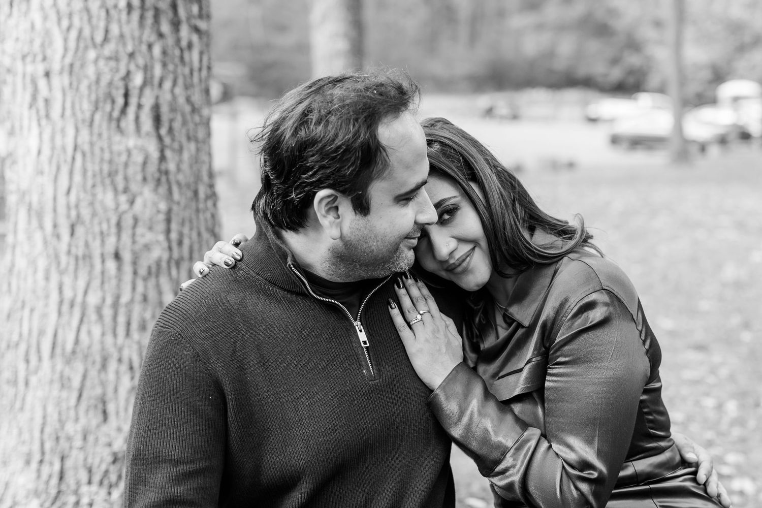 Candid engagement photos of a couple laughing together outdoors.