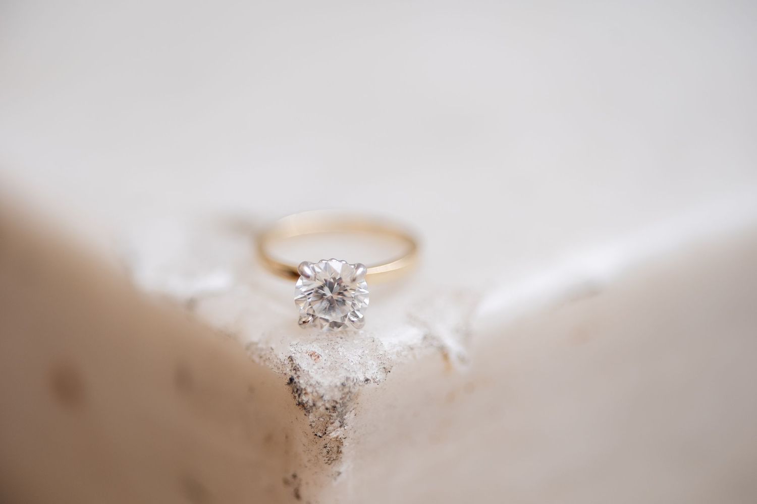 Close-up macro shot of a sparkling diamond engagement ring.