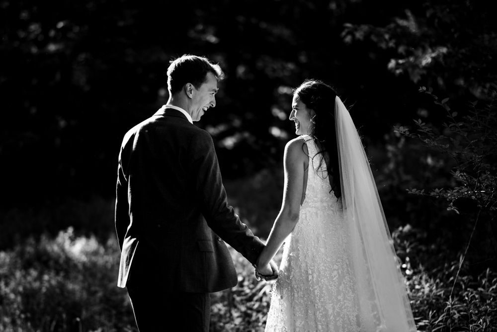 A Wedding couple takes a stroll together after their ceremony in Vermont