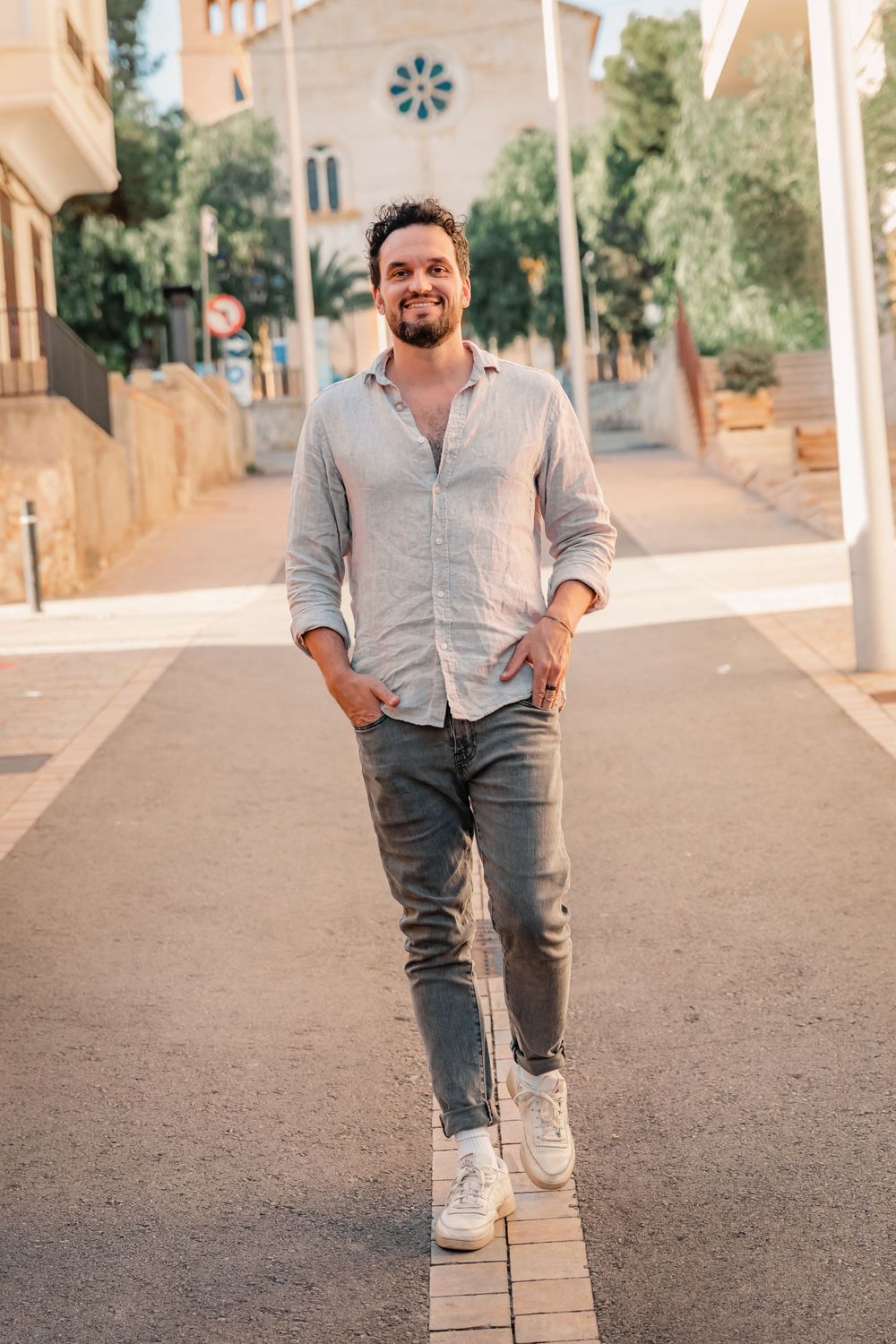 business photography of coach walking on street in Porto Cristo Mallorca.