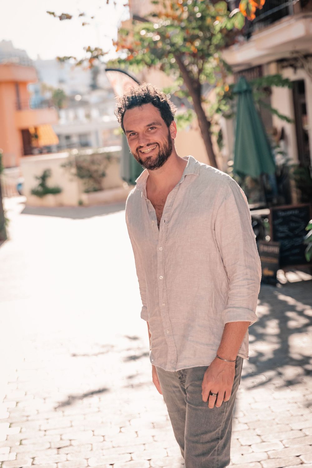 lifestyle portrait of male entrepreneur walking in Porto Cristo Mallorca.