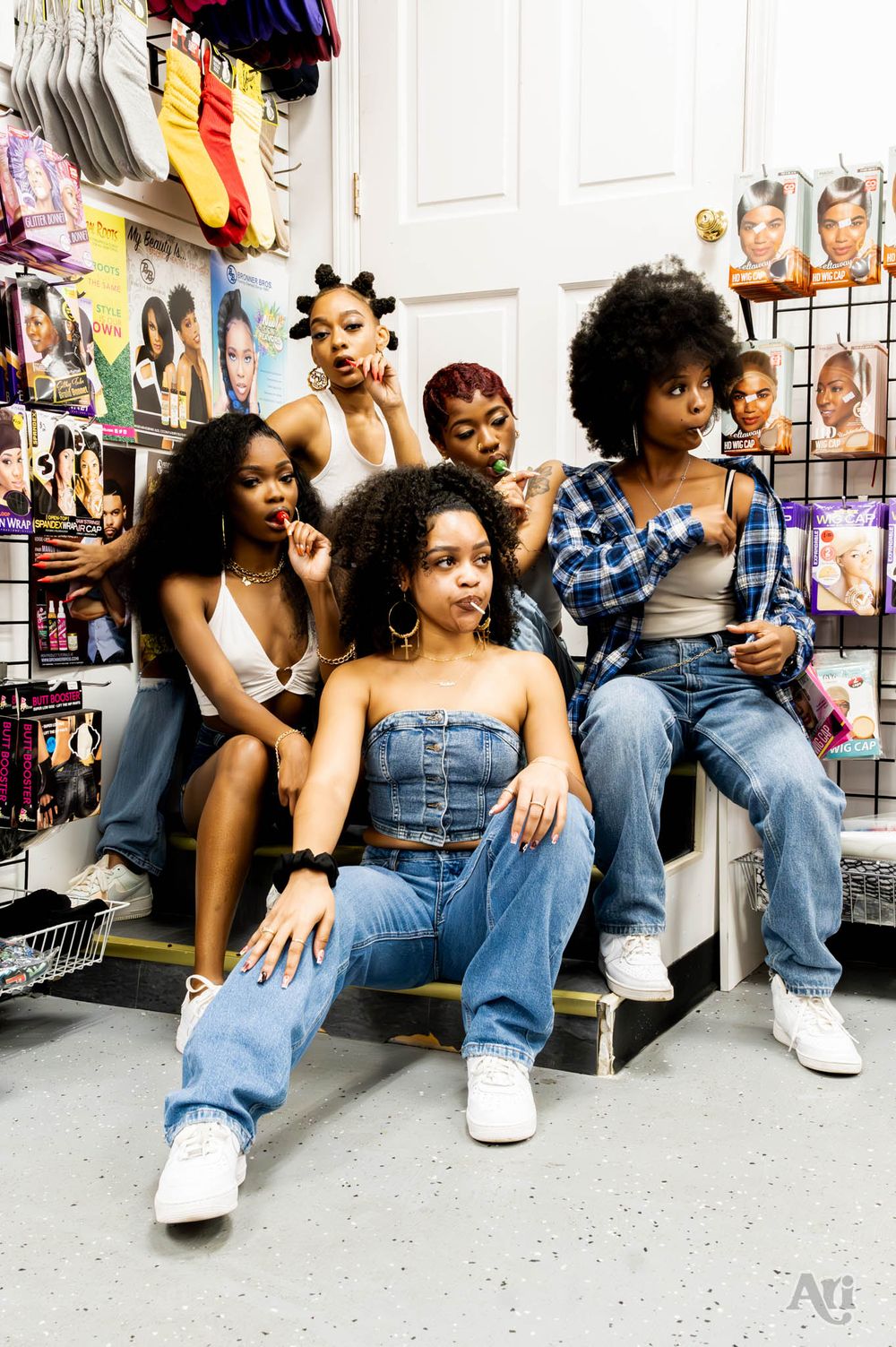 Group of friends having fun together in a beauty supply store surrounded by hair products.