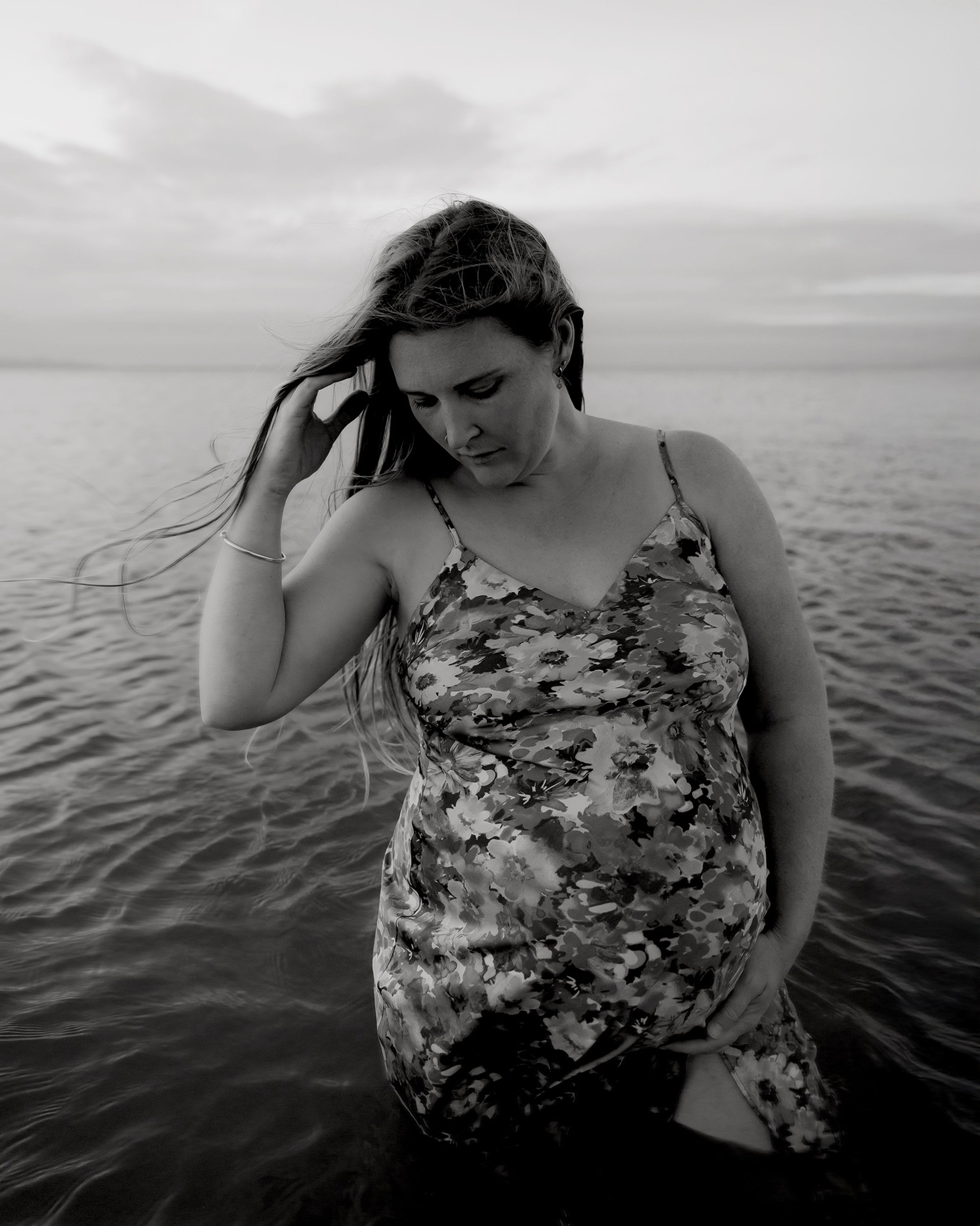 Detail image of expectant mother holding baby bump