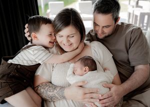 Loving connection between parents and newborn baby