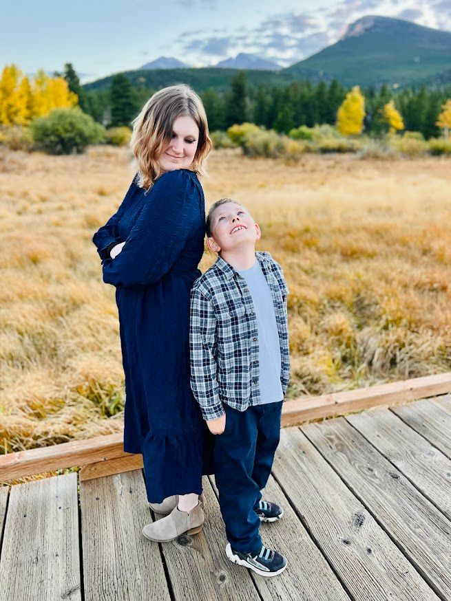 boy and girl standing back to back looking at each other