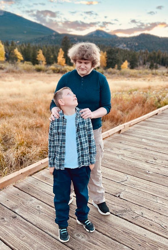 two people standing one in front of the other looking at each other