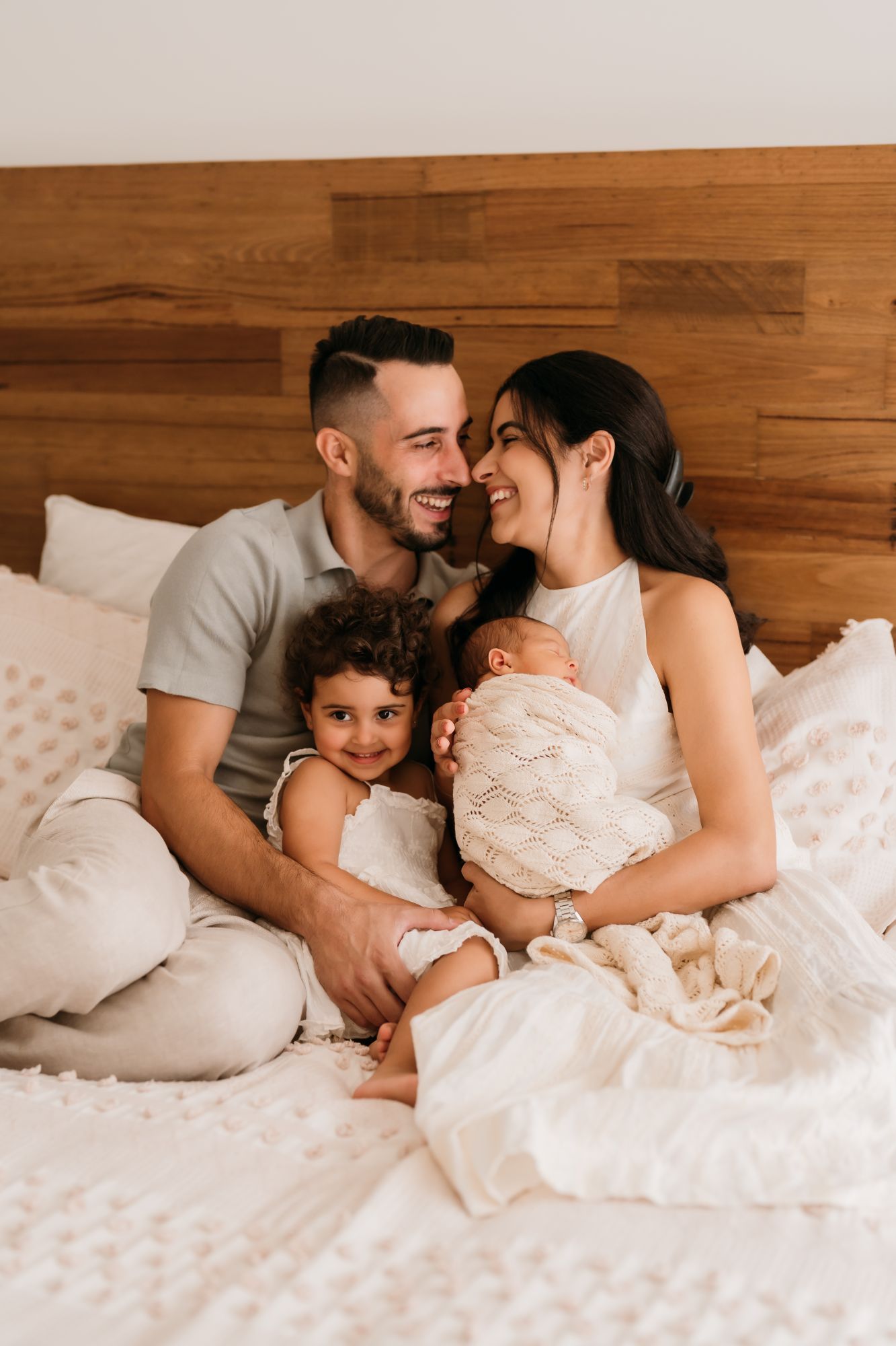 Calm in-home newborn session with minimal styling