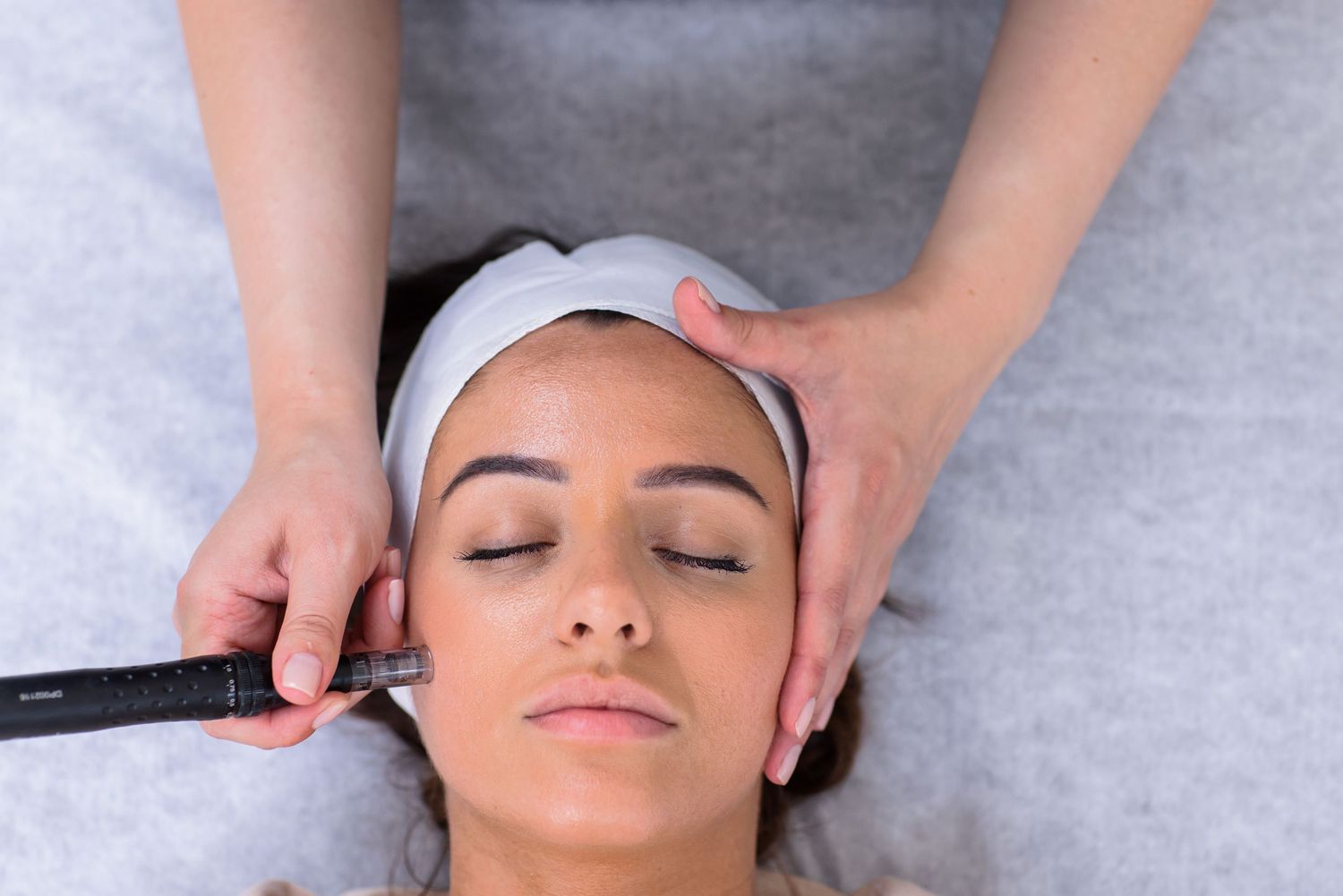 Close-up of facial treatment being performed on client in spa setting.