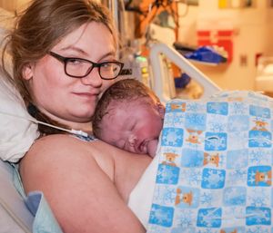 A series of tender moments in a hospital room with blue patterned bedding.