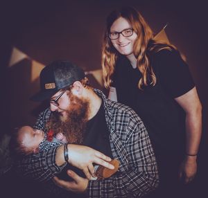 Series of candid family moments captured during indoor photo session with decorative elements.
