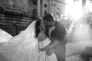 Black and white wedding portraits with dramatic lighting and architecture.