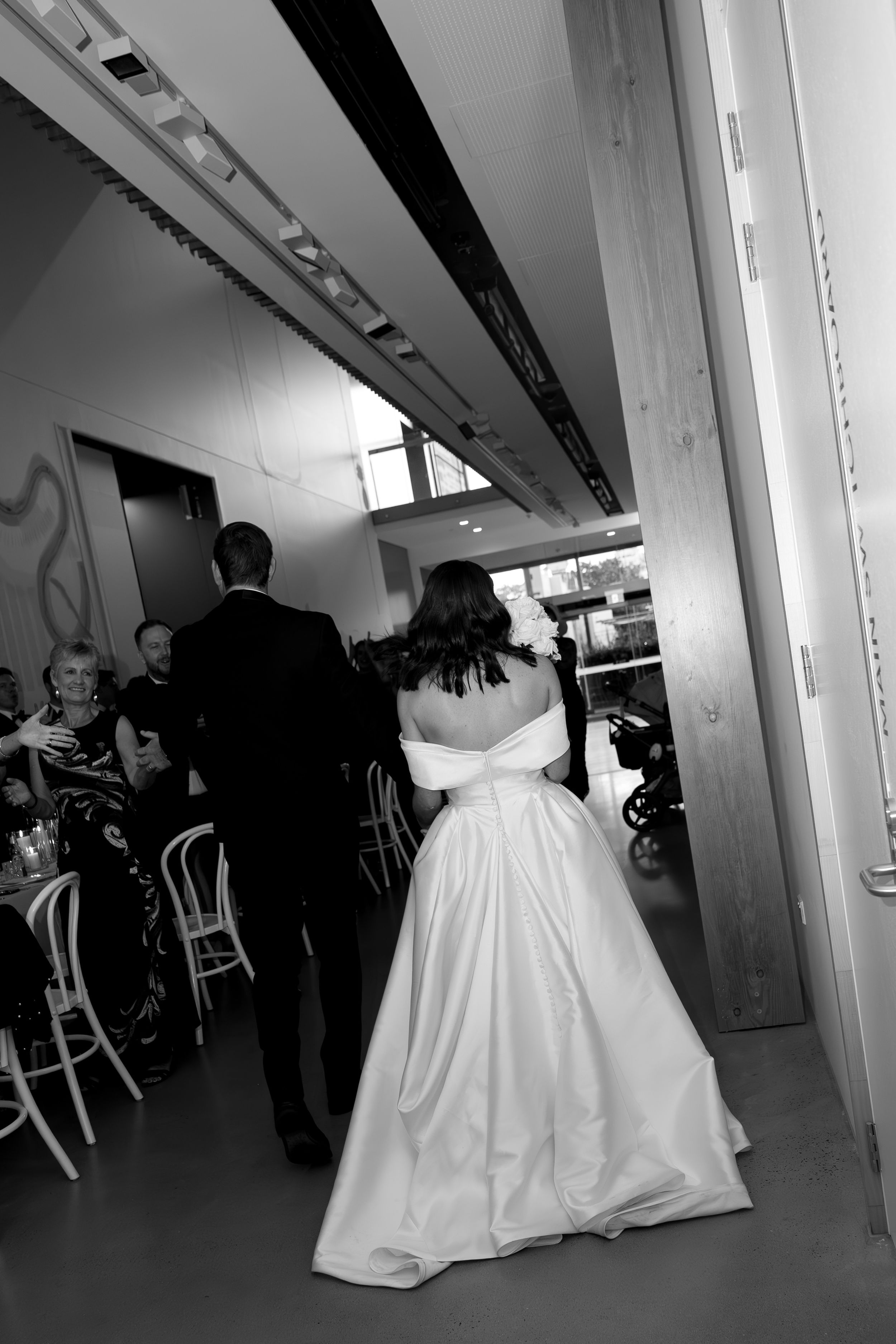 Black and white candid wedding reception moments.