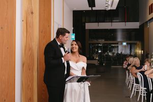 Modern wedding venue interior with wood paneled walls and minimalist decor.