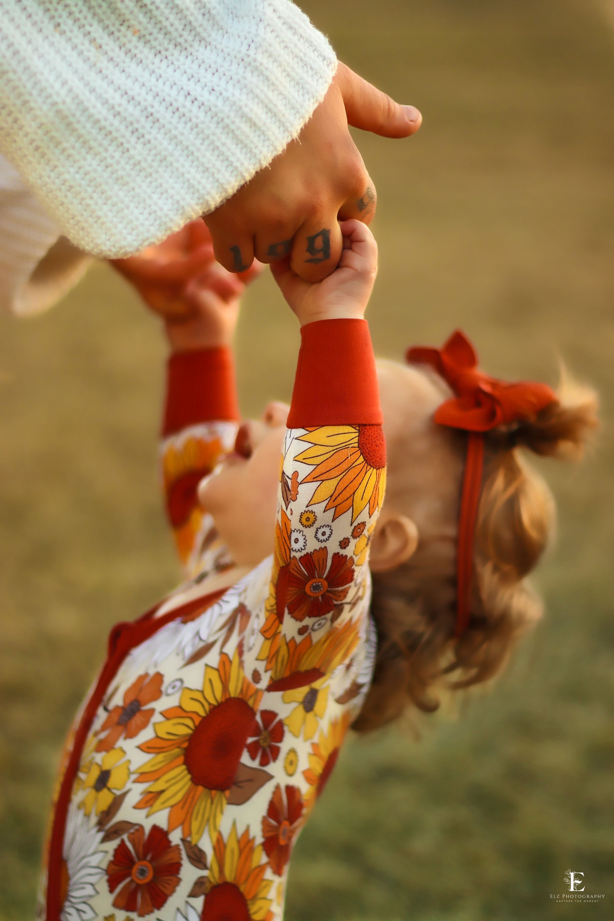 Close-up of floral patterned with sunflower design against grass background in Williston, North Dakota.