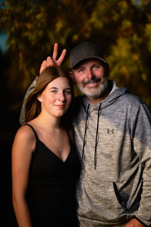 Intimate portrait session at dusk with dramatic lighting and natural backdrop in Pierre, South Dakota.