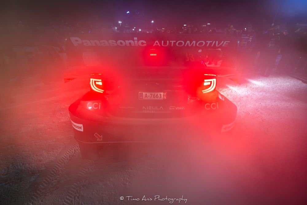 A sequence of car brake lights glowing red in a dark environment creating a dramatic lighting effect.