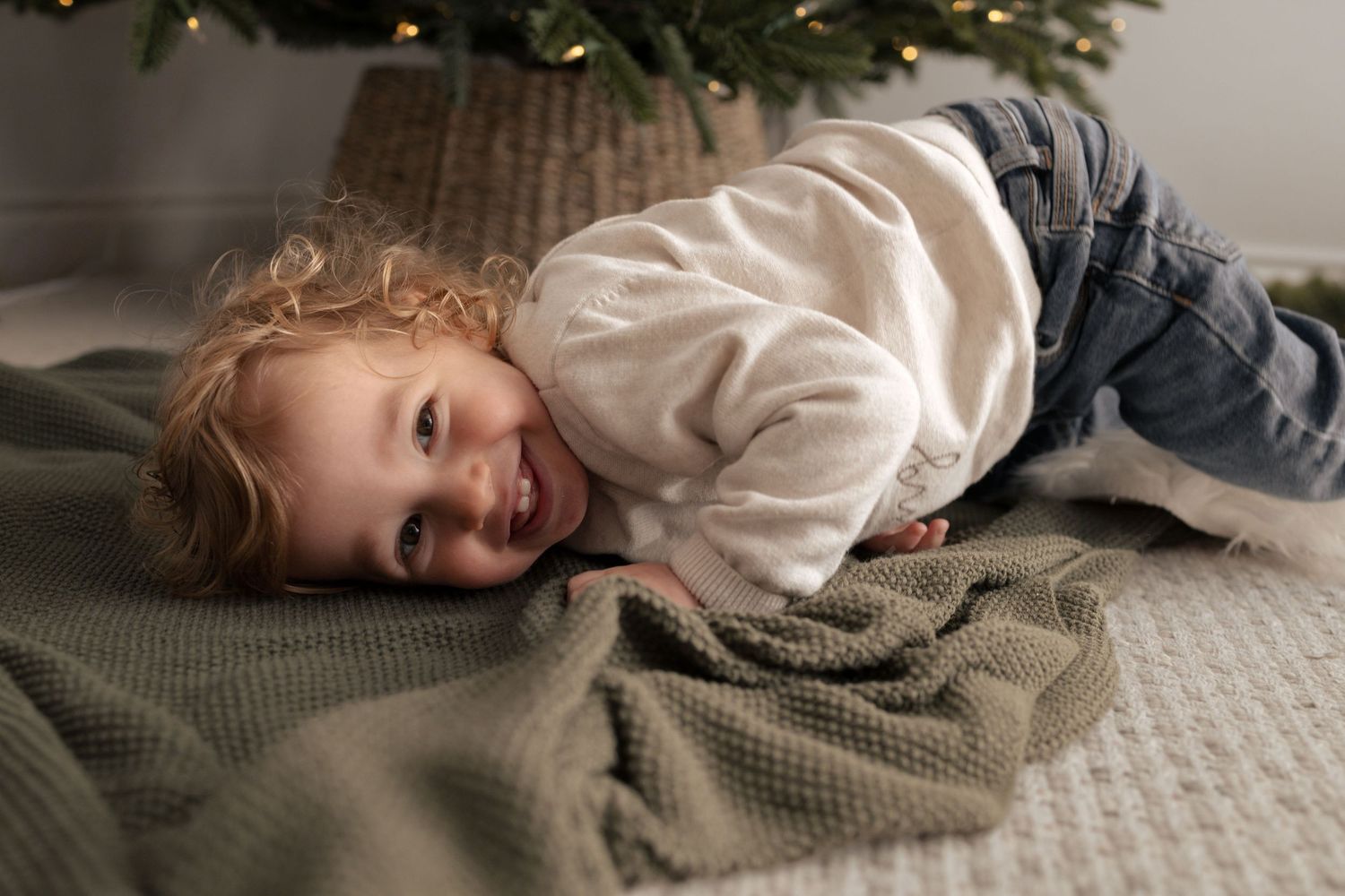 Cozy lifestyle photos on gray blanket with natural window lighting. Photography in Buckinghamshire.