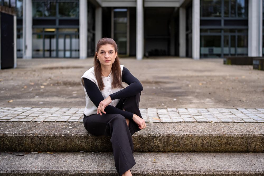 Person in black outfit sitting on stone steps in multiple poses showing different angles and positions.