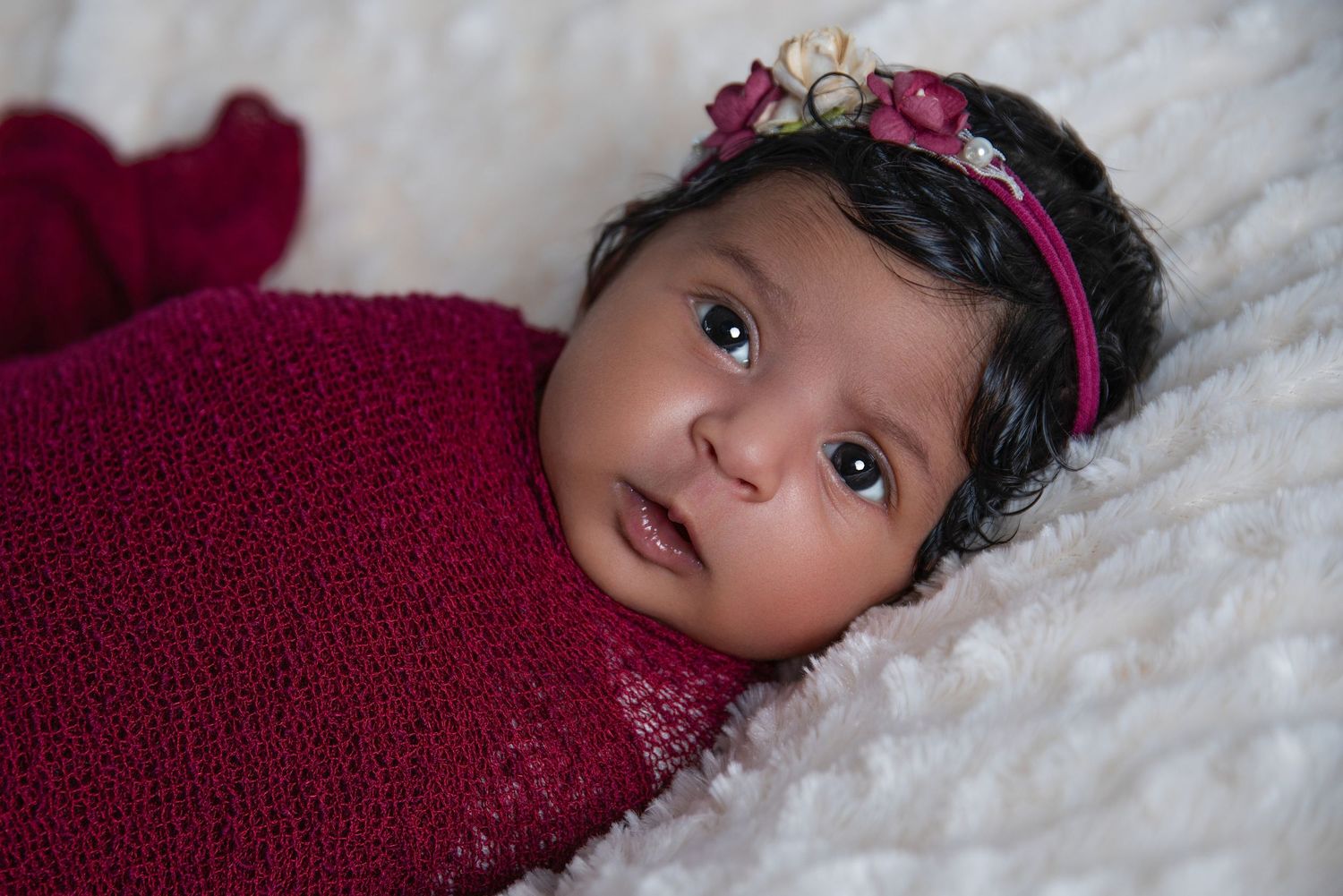 newborn baby girl wide awake for newborn photoshoot