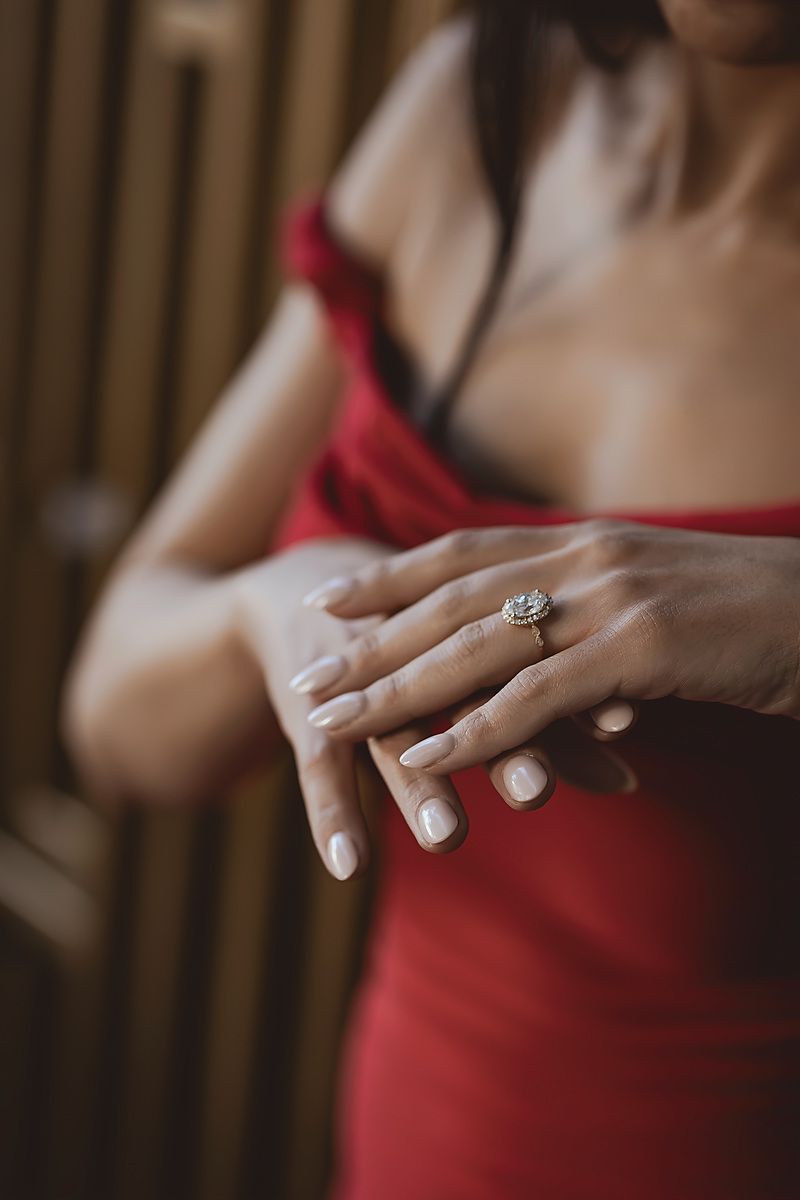 Bride-to-be adjusting her ring before proposal at TRS Coral Hotel.