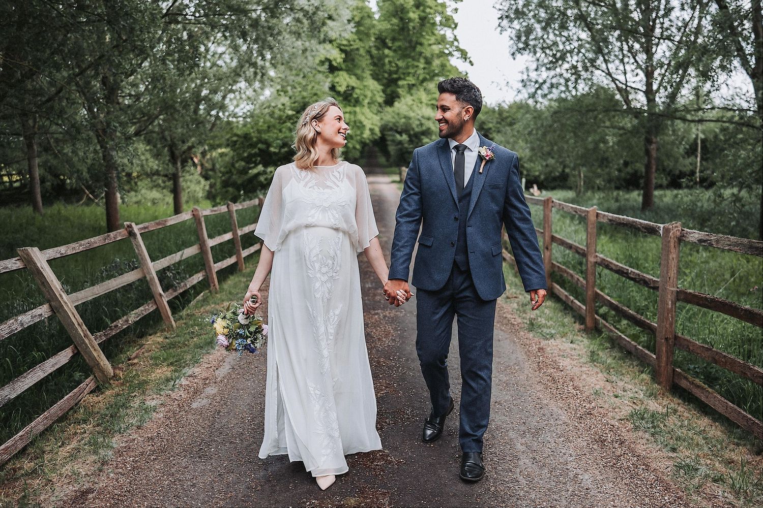 Elegant wedding bouquets featuring blush roses and greenery alongside formal attire.