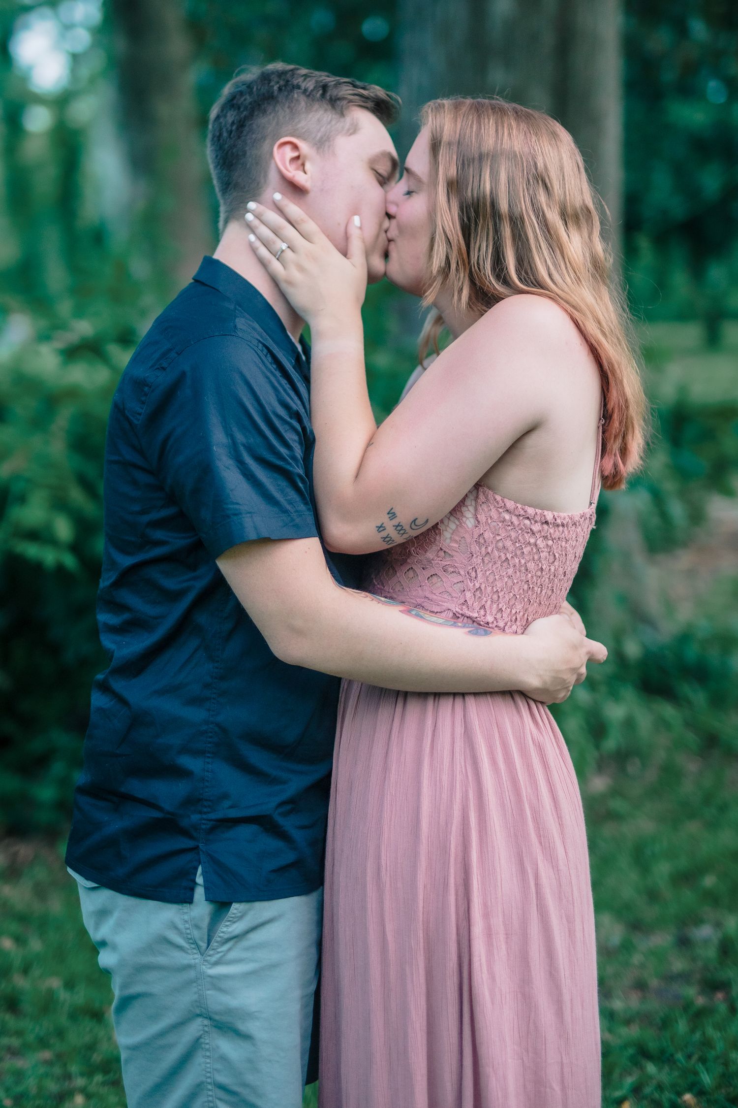 Romantic engagement photo session in nature, kissing and celebrating, Amherstburg, Ontario.