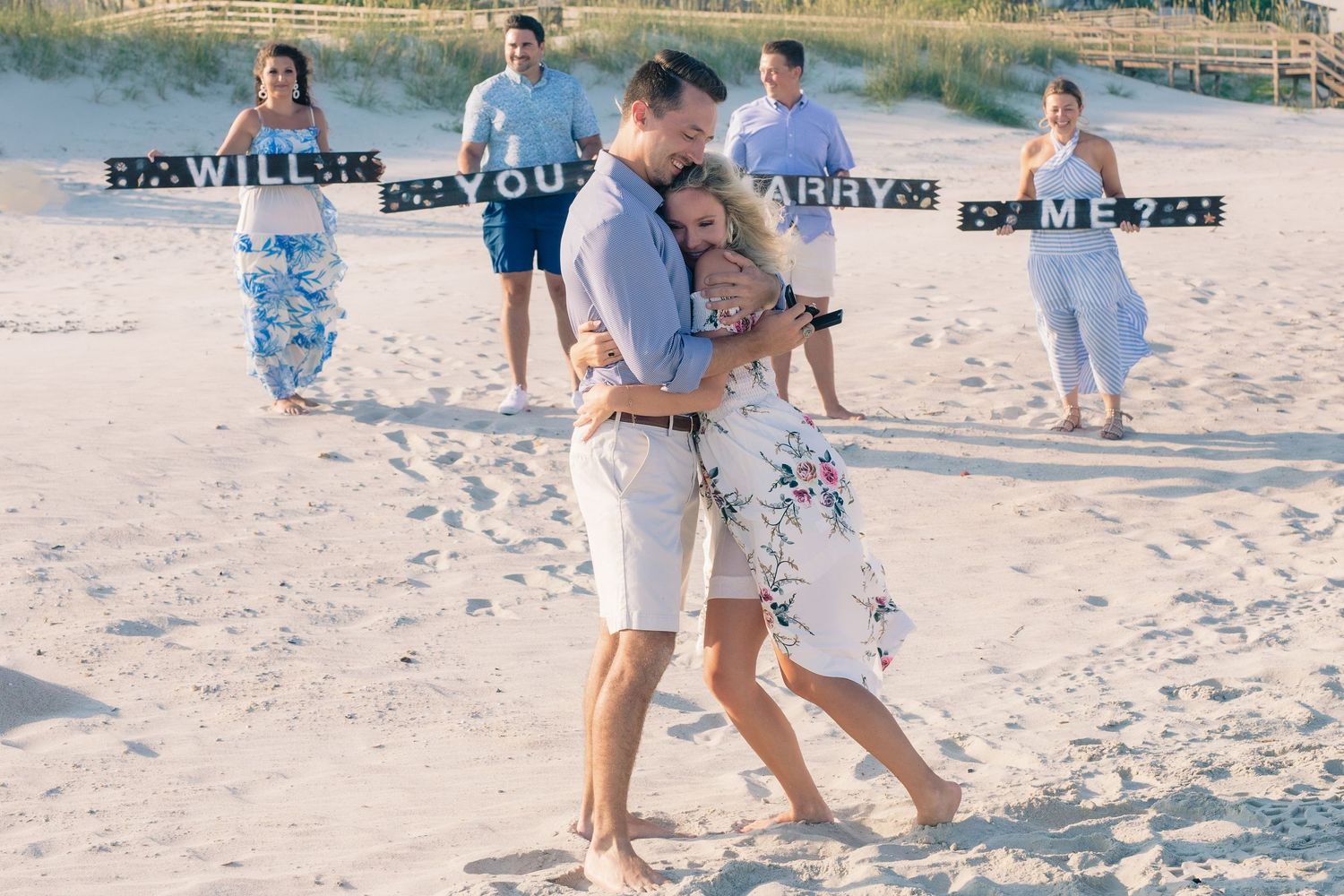 Heartfelt “yes” moment captured perfectly at surprise engagement, Essex County captured by Tasha Cannaday.