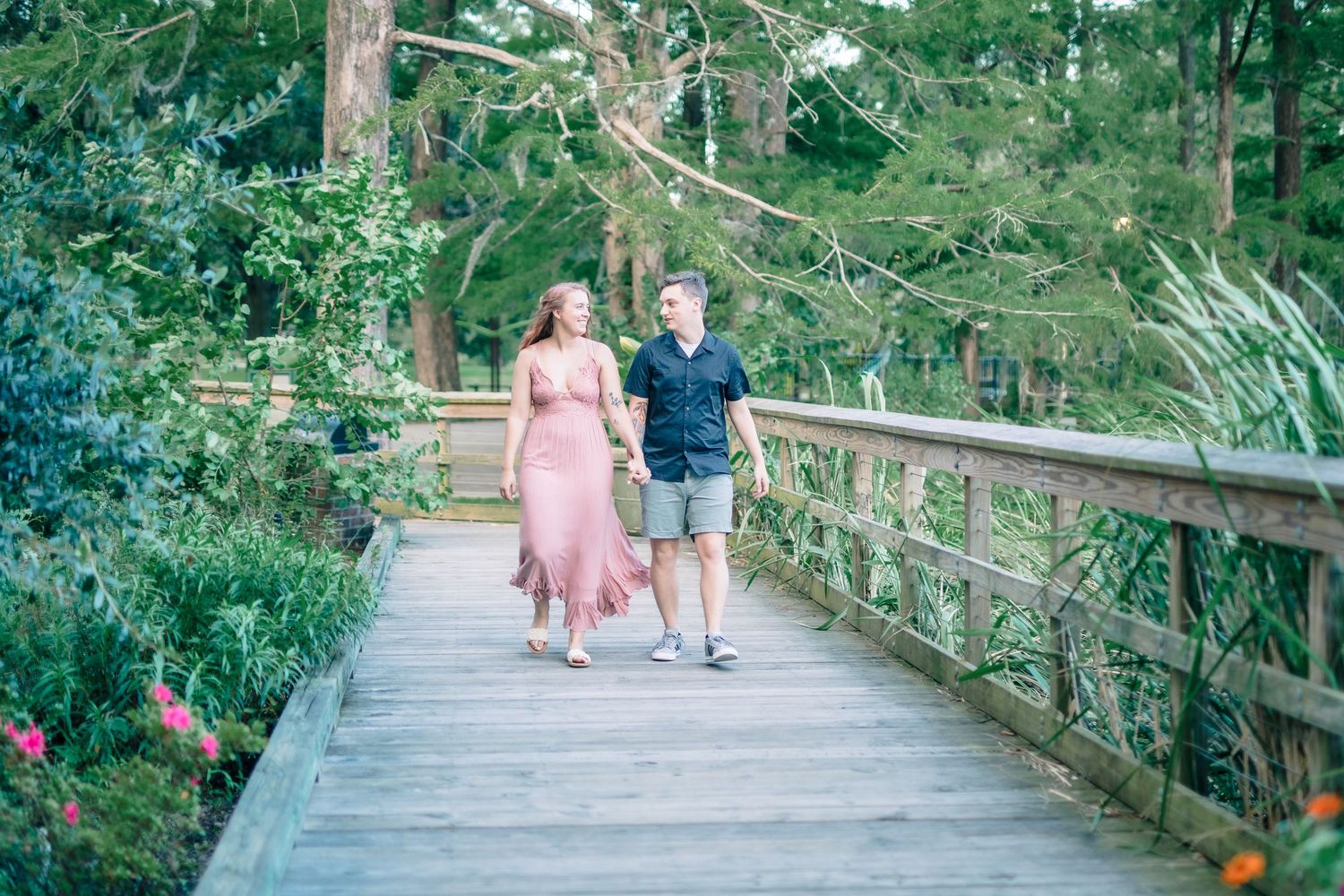 Newly engaged couple holding hands, walking in nature, Windsor engagement shoot.