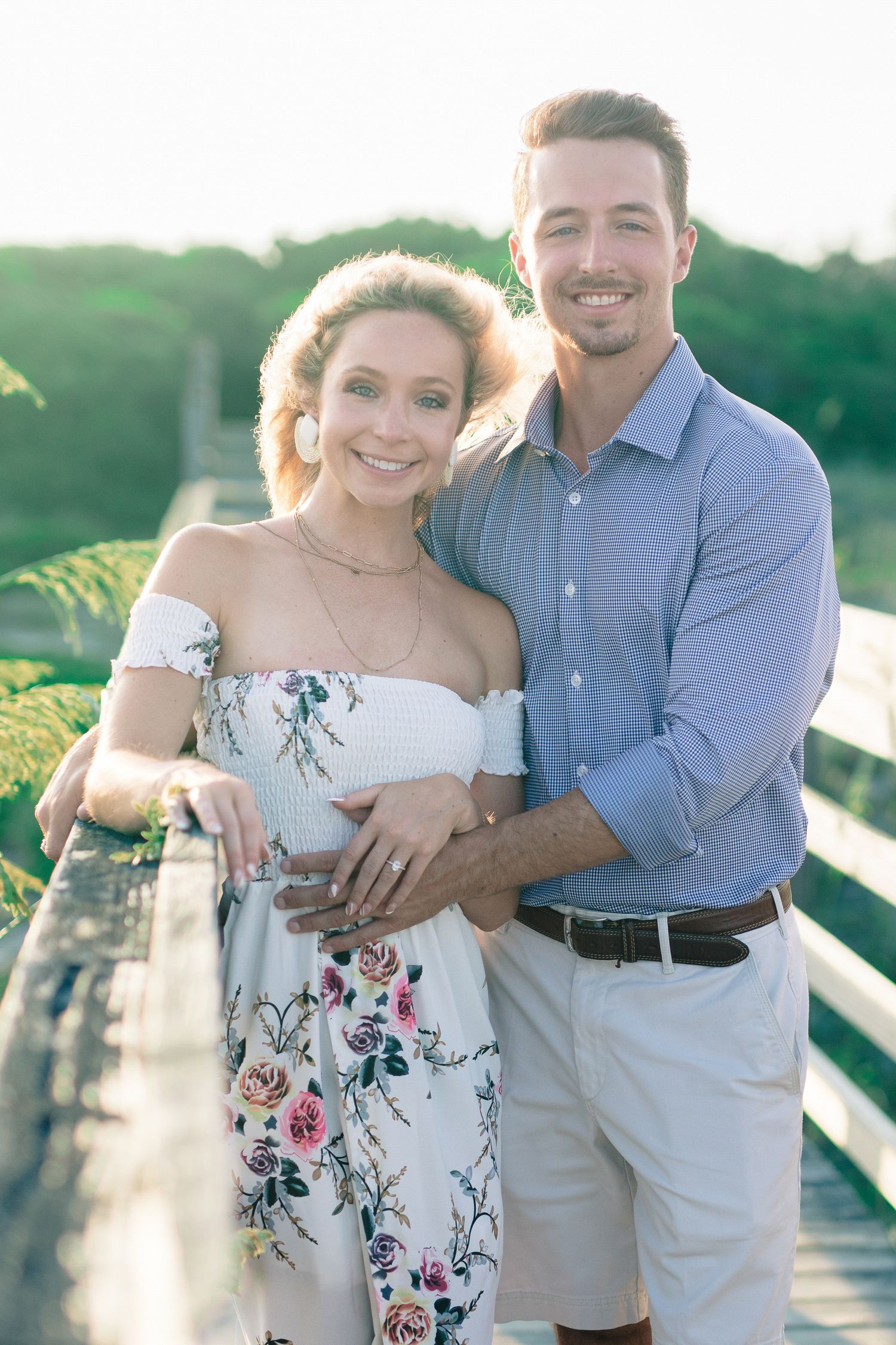 Couple celebrating their engagement by the water in Essex County.
