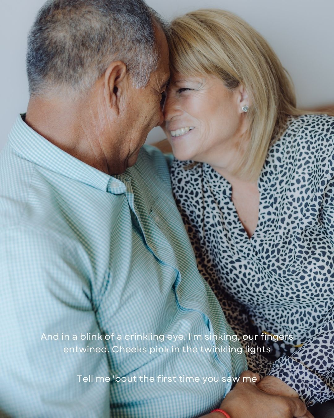 Older couple touching foreheads intimately with romantic song lyrics overlaid on the image.