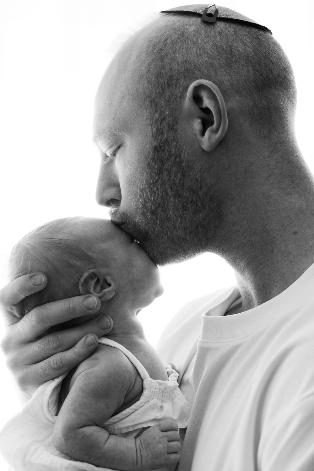 Black and white profile portraits showing a series of emotional expressions with hands touching face and neck.