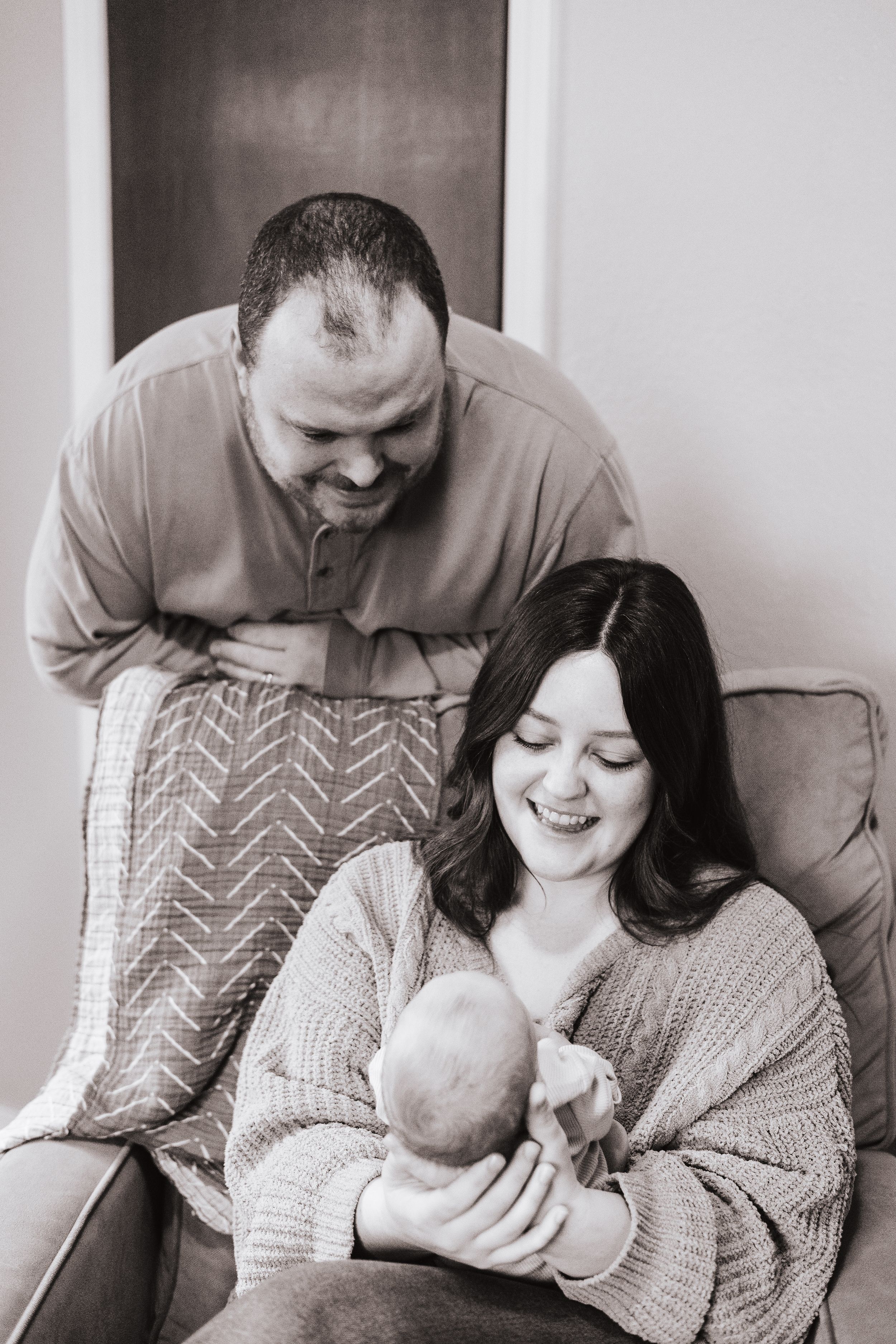 Black and white photo series showing tender family moments with their newborn.