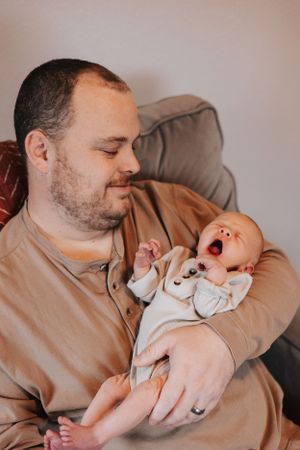 Sequence of intimate moments between parent and sleeping newborn in warm tones.