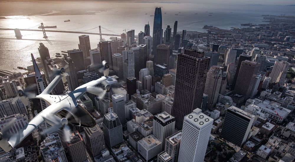 An aerial view of a small aircraft flying over San Francisco skyline with skyscrapers and bay visible below.