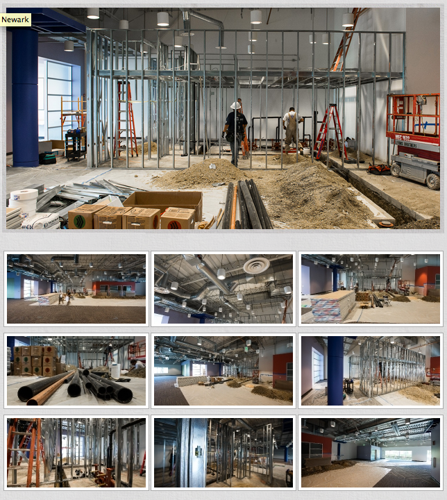 Construction site showing plumbing and HVAC installation progress in commercial space with exposed ductwork and piping.