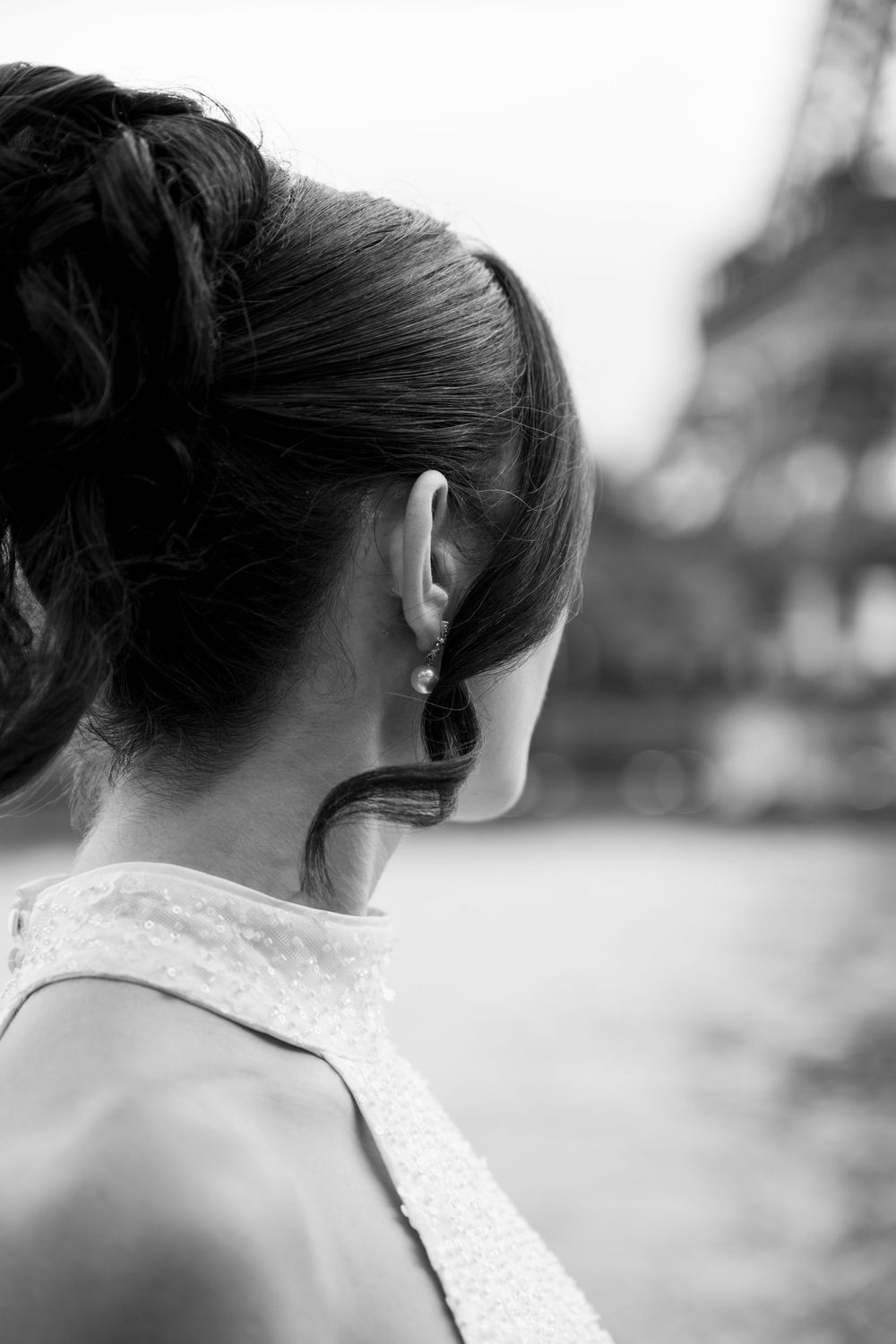Black and white artistic portrait series showing an elegant updo hairstyle from different angles in Paris.