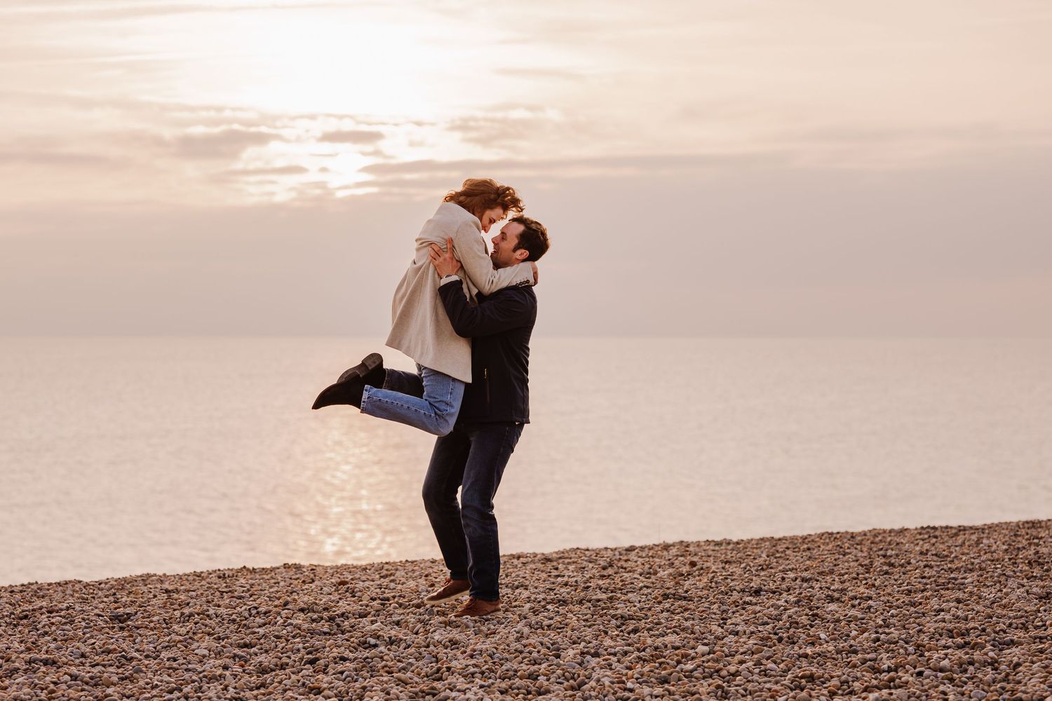 Engagement photos on Chesil Beach Weymouth and Portland. Candid Wedding photographer Weymouth, Portland Dorset.