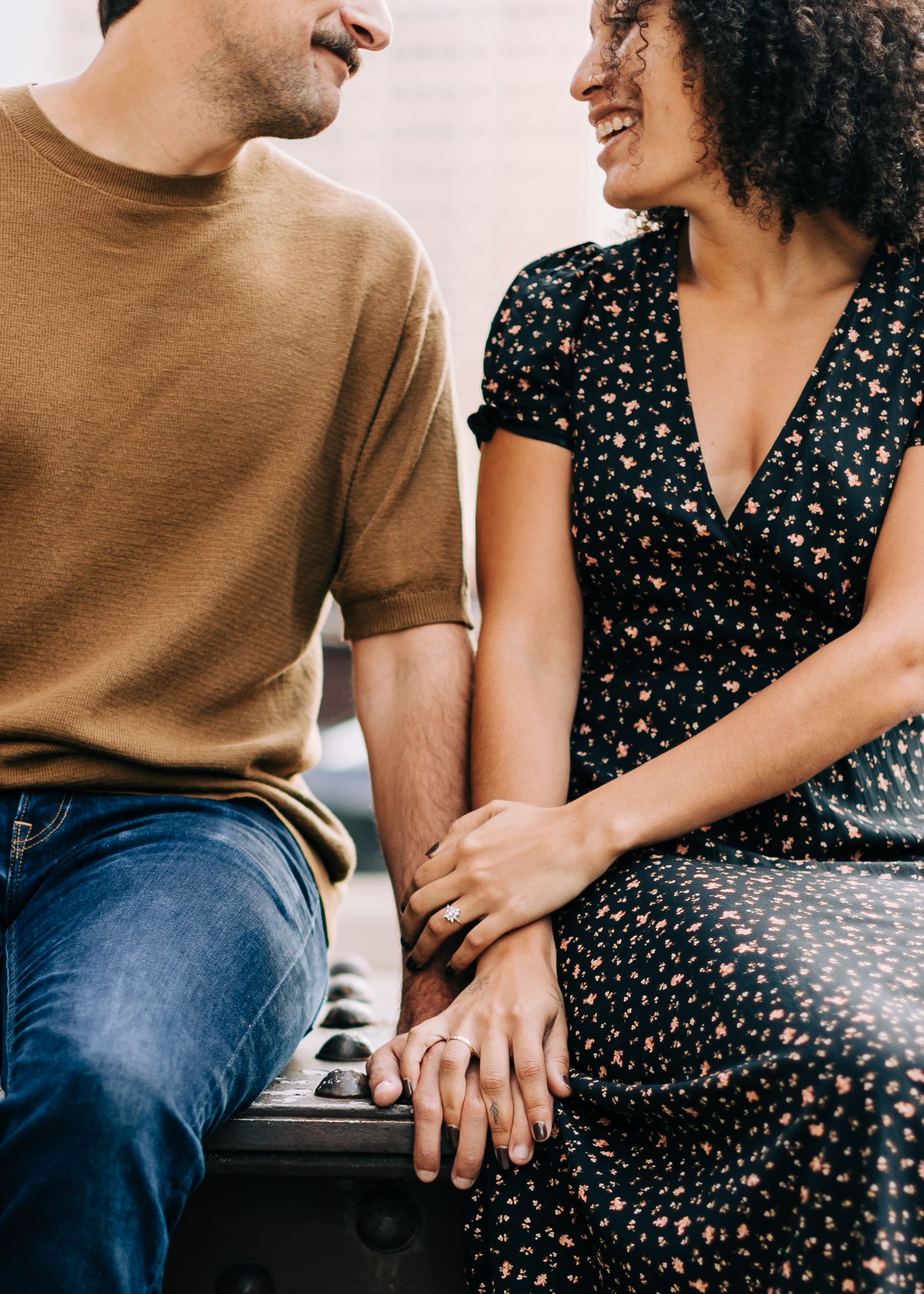 Chicago couples engagement session, with relaxed candid moments and natural connection on a bridge near the Riverwalk