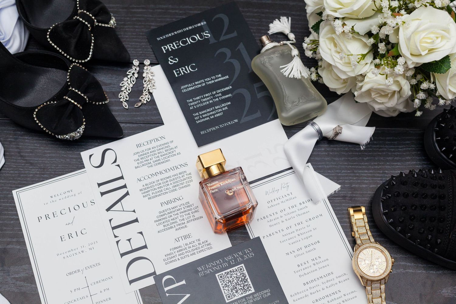 Black and white modern wedding invitations with floral accents and elegant typography on a dark surface.